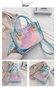 Detail of blue laser PVC transparent tote bag with golden metal buckle and inner pouch