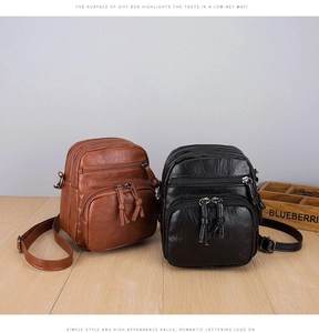 Detail view of vintage multi-pocket crossbody bags in brown and black leather texture