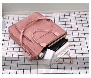 Detailed view of pink corduroy tote bag interior showcasing large storage capacity