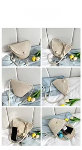 Detail view of woven straw bucket bag with large pearl closure and interior storage