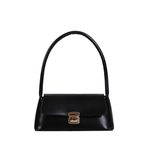 Classic black leather handbag with gold metal clasp and curved handle on white background