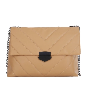 Chic beige quilted chain crossbody bag with V-shaped stitching and matte black buckle