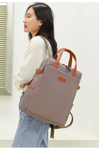 Grau-violetter Business-Rucksack für Damen mit orangefarbenen Griffen in der Seitenansicht