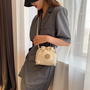 Women's forest style straw bucket bag with sunflower detail and drawstring closure