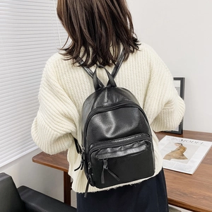 Classic black faux leather backpack with litchi texture and front zipper pocket