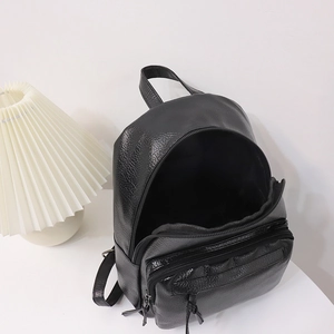 Minimalist black lychee texture leather backpack with spacious main compartment for women