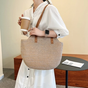 Retro large capacity straw woven tote bag with brown leather handles for beach vacation