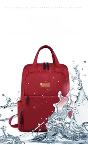 Waterproof Oxford fabric detail of the red backpack showing splash-proof material and texture