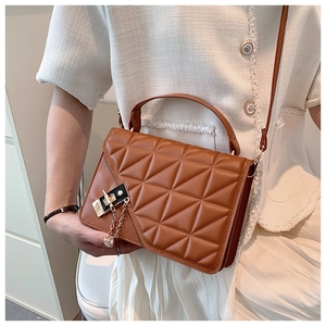Brown quilted leather crossbody bag featuring a silver metal buckle and chain detail