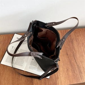 Deep grey frosted leather tote bag with brown handles and spacious interior compartments