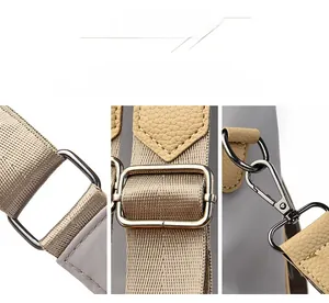 Detail of silver-tone hardware with adjustable straps and buckles on nylon backpack