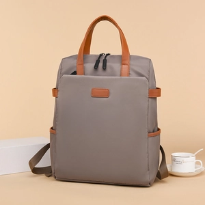 Taupefarbener wasserdichter 15,6-Zoll-Laptop-Rucksack mit braunen Ledergriffen und Design