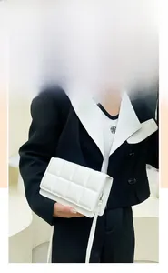 White quilted square crossbody bag with classic pattern and matching strap detail