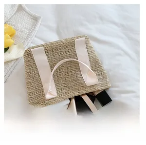 Top view of straw tote bag showing large capacity for phone, lipstick and makeup kit