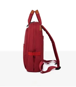Side view of dark red Oxford backpack showing side pockets and padded shoulder straps