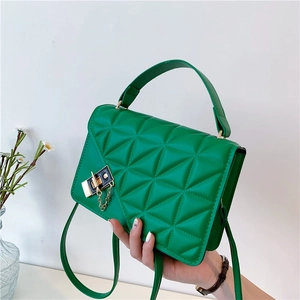 Bright green quilted crossbody bag with diamond pattern and gold chain strap