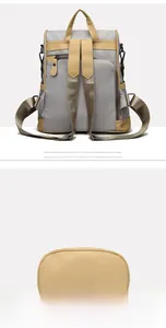Detail view of the nylon backpack rear anti-theft pocket and wide leather bottom base