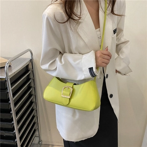 Minimalist fluorescent yellow leather baguette bag with a stylish gold square buckle detail