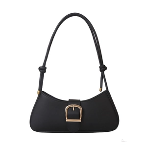 Chic black baguette shoulder bag with gold horseshoe buckle and knotted strap detail