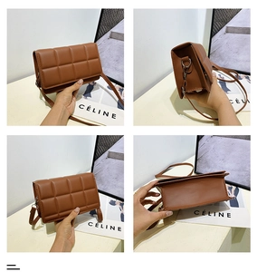 Detail view of brown quilted crossbody bag with textured faux leather finish