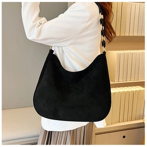 Black frosted hobo shoulder bag with a unique black acrylic and gold link chain strap