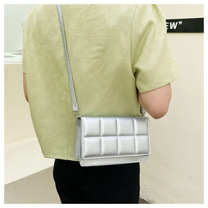 Detailed back view of a silver metallic quilted crossbody square bag with a leather strap
