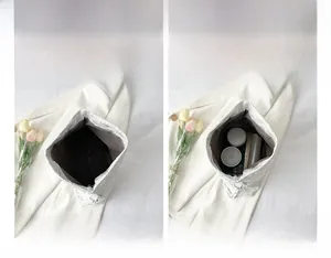 Internal view of silver chain bag showing storage space for phone and cosmetics