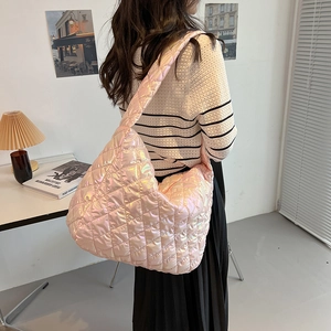 Pink holographic quilted tote bag with diamond pattern shown on a model for daily style