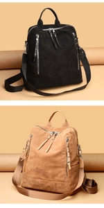 Detail of corduroy backpacks in black and khaki with multiple silver zipper pockets