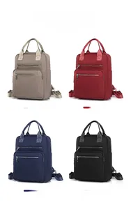 Quatrefoil quilted nylon backpack shown in khaki, red, blue, and black color options