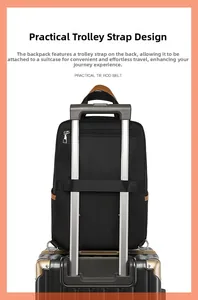 Detail of black oxford laptop backpack with luggage strap secured on a suitcase handle