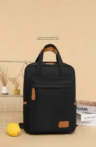 Close-up of waterproof black oxford backpack with brown leather handle and zipper detail