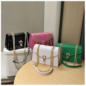 Group shot of colorful crocodile pattern chain bags in black, pink, white and green