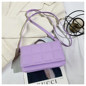 Detailed view of lavender purple quilted crossbody bag with soft bubble texture