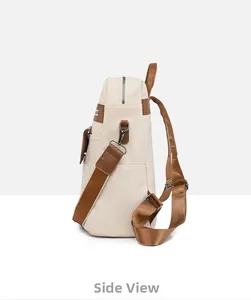 Side view of faux leather backpack in cream and brown with adjustable nylon straps