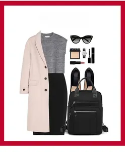 Flat lay of black nylon backpack with elegant outfit and chic travel accessories