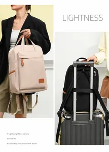 Waterproof Oxford fabric backpack detail showing the luggage strap feature for easy travel