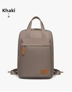 Front view of khaki waterproof nylon backpack with leather handles and laptop compartment