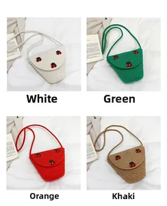 Mini handwoven crossbody bag with cherry decorations in four different color options