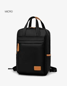Side view of black waterproof nylon laptop backpack with brown leather trim and side pocket