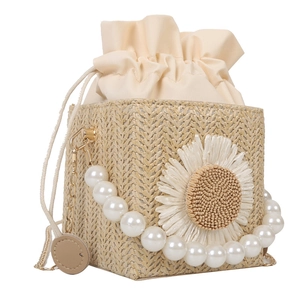 Straw weave bucket bag with giant raffia daisy and pearl beaded handle decoration