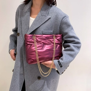 Purple quilted puffer tote bag with gold chain straps and handmade side label