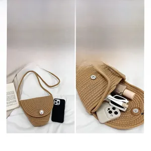 Detail view of woven mini bag interior storage for phone and accessories with pearl flap