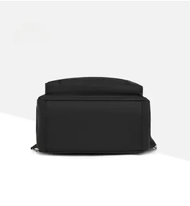 Detail view of the durable oxford fabric bottom and reinforced stitching on this black backpack
