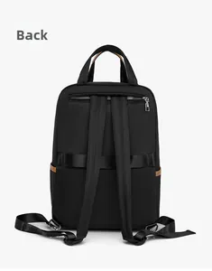 Detail view of the black backpack's back with luggage strap and hidden zipper pocket