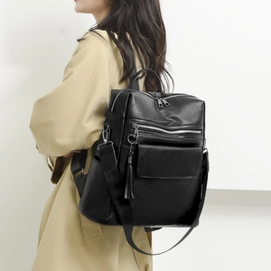 Chic black PU leather backpack for women with multi-pocket design and tassel detail