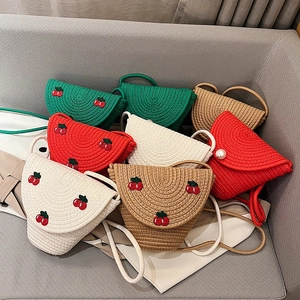 Handmade woven crossbody bags with cherry embroidery and pearl closure in various colors