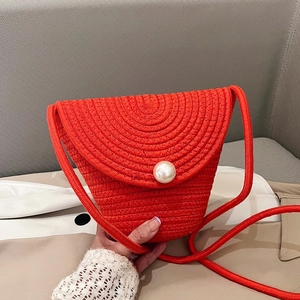 Mini red straw woven crossbody bag with pearl buckle and elegant thin shoulder strap