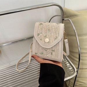 Chic beige woven square crossbody bag with green leaf embroidery and cream leather trim