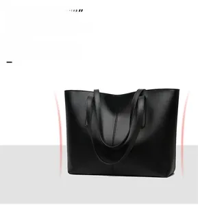 Detail view of premium black cowhide tote bag featuring reinforced stitching and waterproof leather